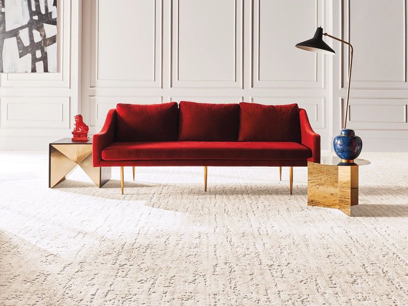 Red couch on carpet from Milford Floor Covering in Milford